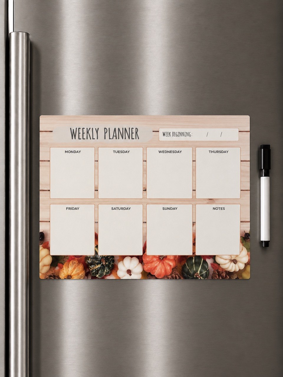 Autumn harvest magnetic weekly planner on refrigerator with marker