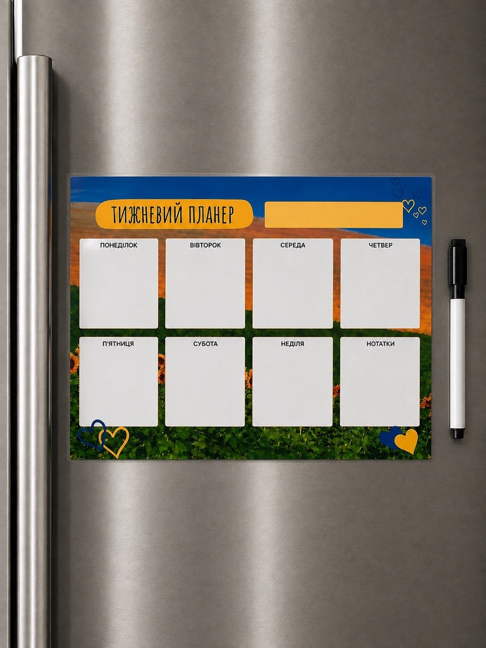 Magnetic weekly planner with sunflower sunset design on a refrigerator