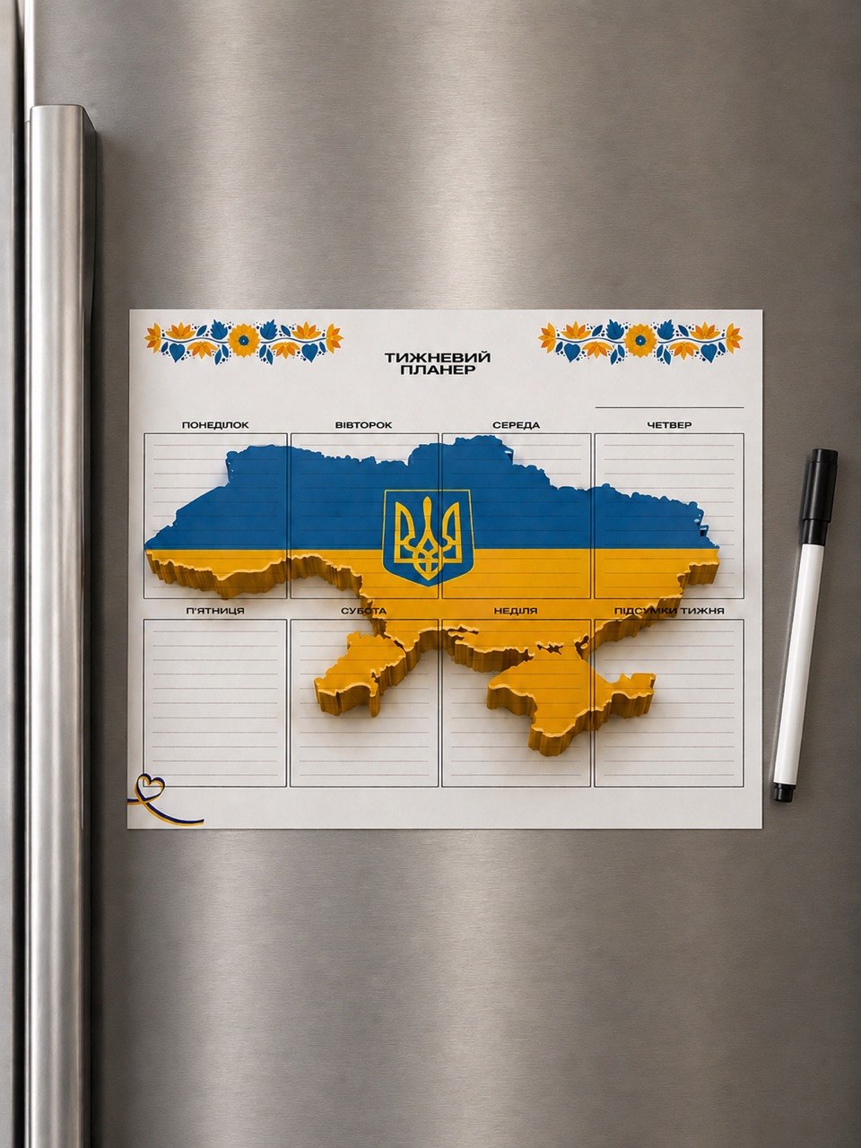 Ukraine map and trident magnetic weekly planner on refrigerator with black marker