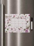 Pink floral Ukrainian magnetic monthly planner on refrigerator with marker