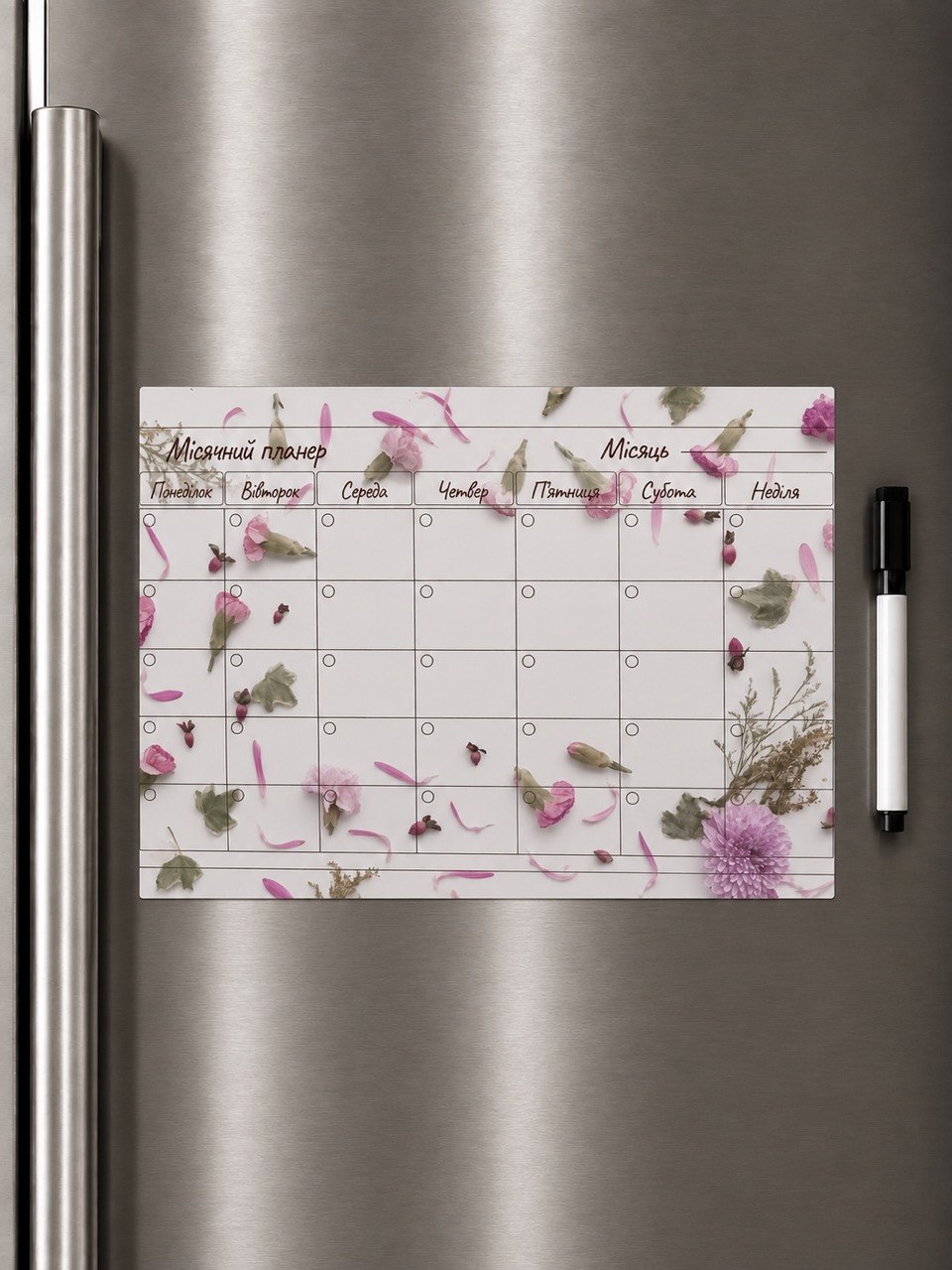 Pink floral Ukrainian magnetic monthly planner on refrigerator with marker