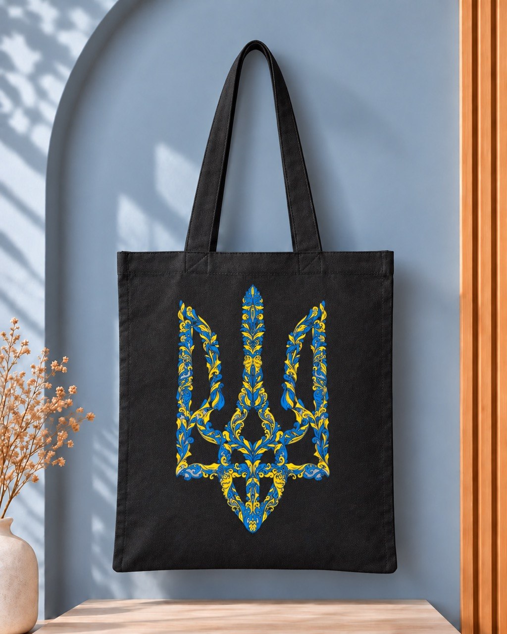 Ornate blue and yellow Tryzub black tote bag